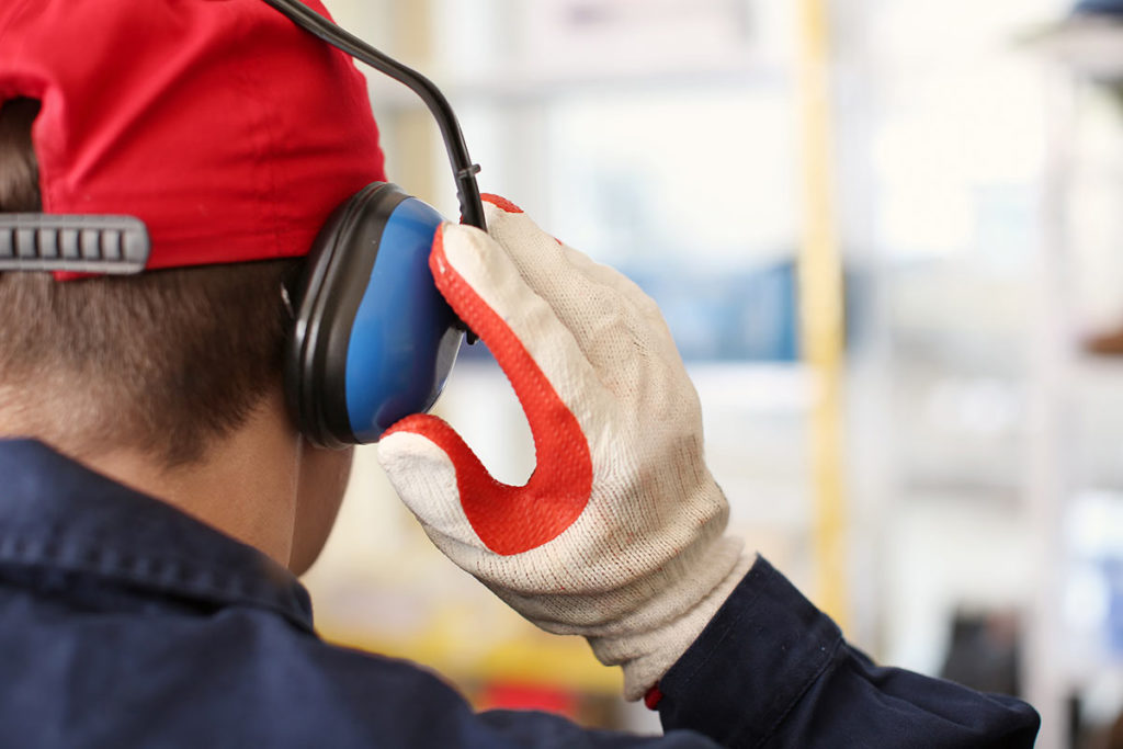 worker wearing protective hearing equipment